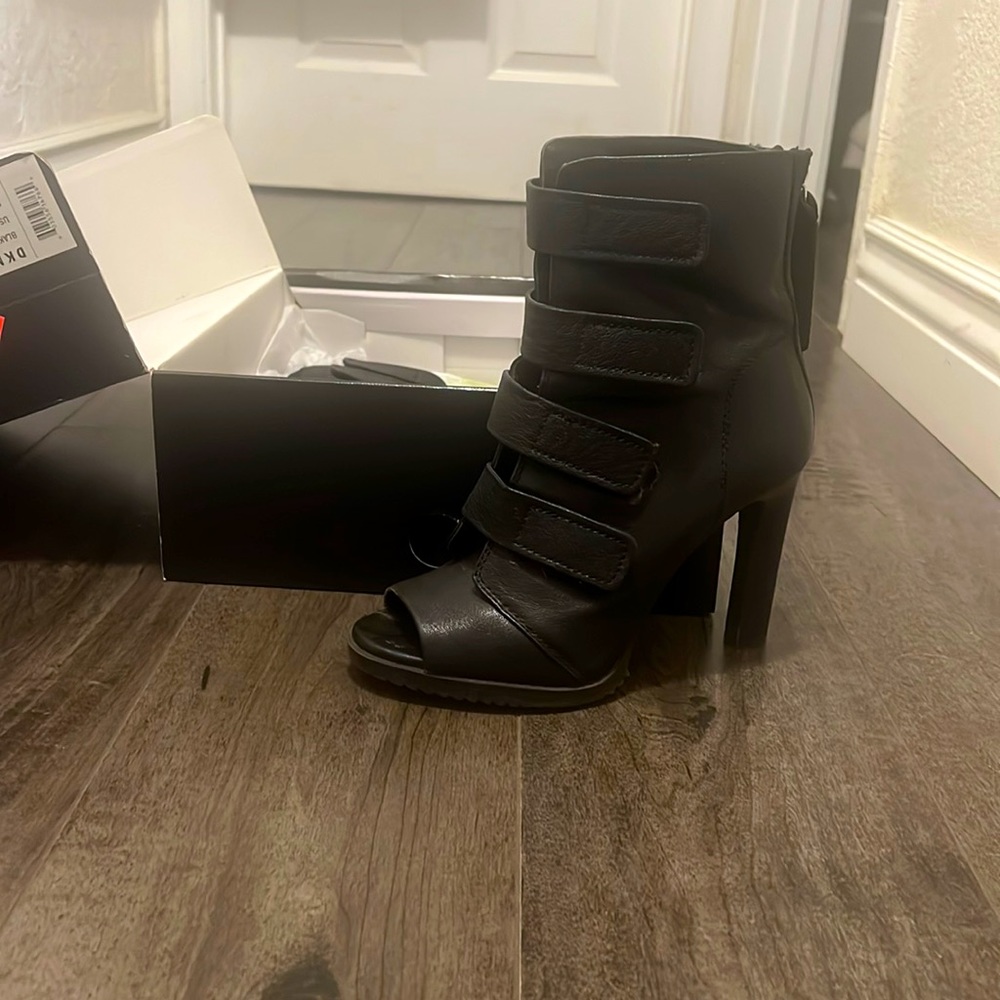 Worn twice only. Very comfy open toe boot style.